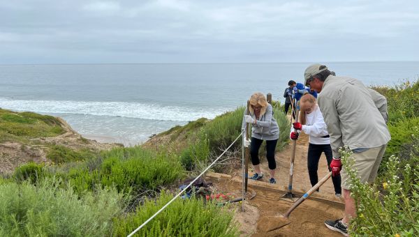 People working on trail maintenance at Crystal Cove State Park.